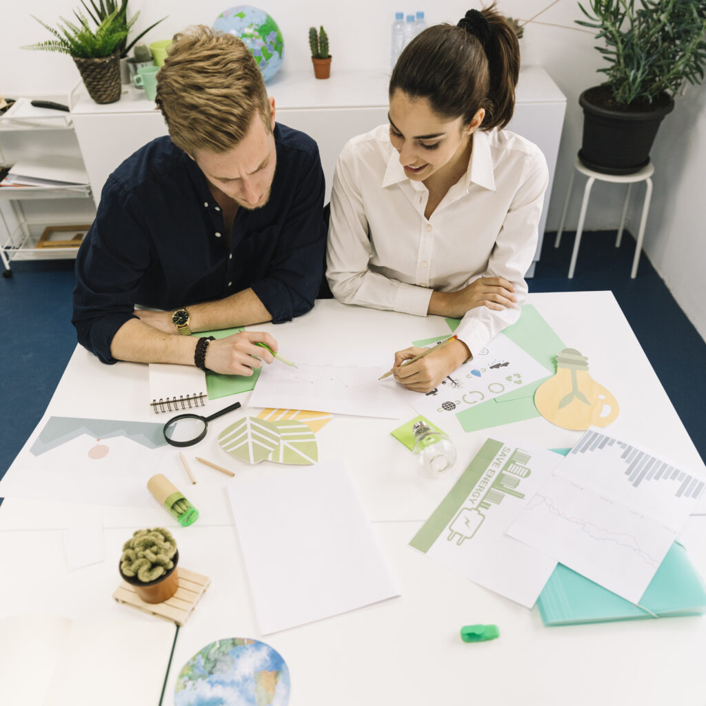 two-businesspeople-analyzing-graph-office